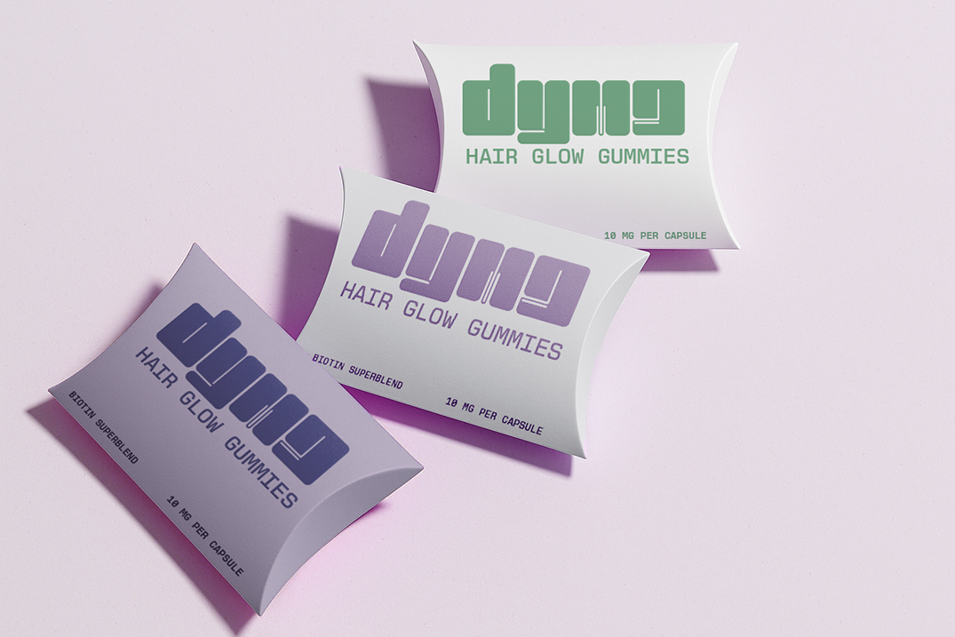 Dymapak hair gummies packaged in paperboard pillow boxes